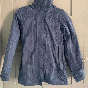 The North Face polka dot blue rain jacket. Size XS. Excellent condition.